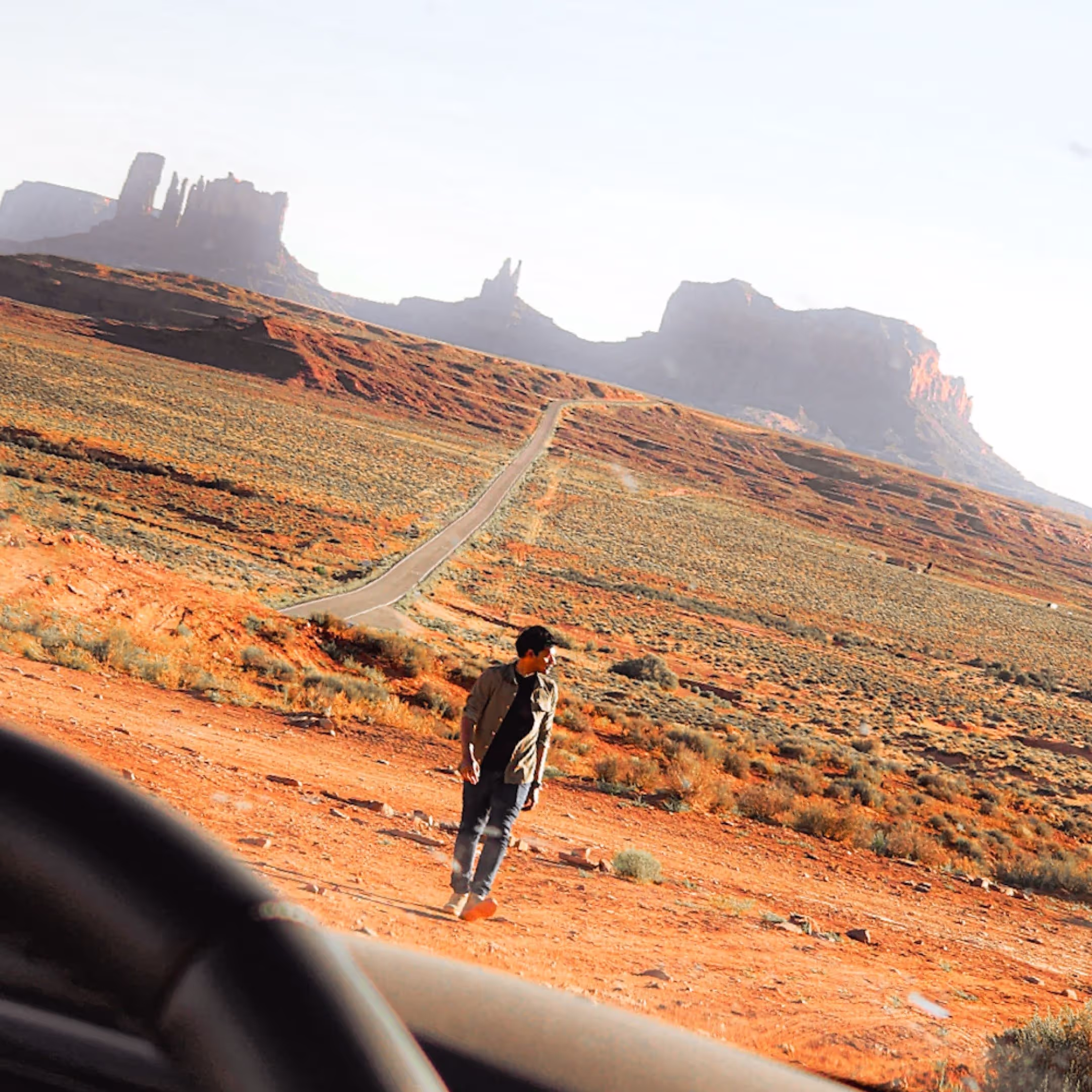 Man in the center with monument valley in the background.
