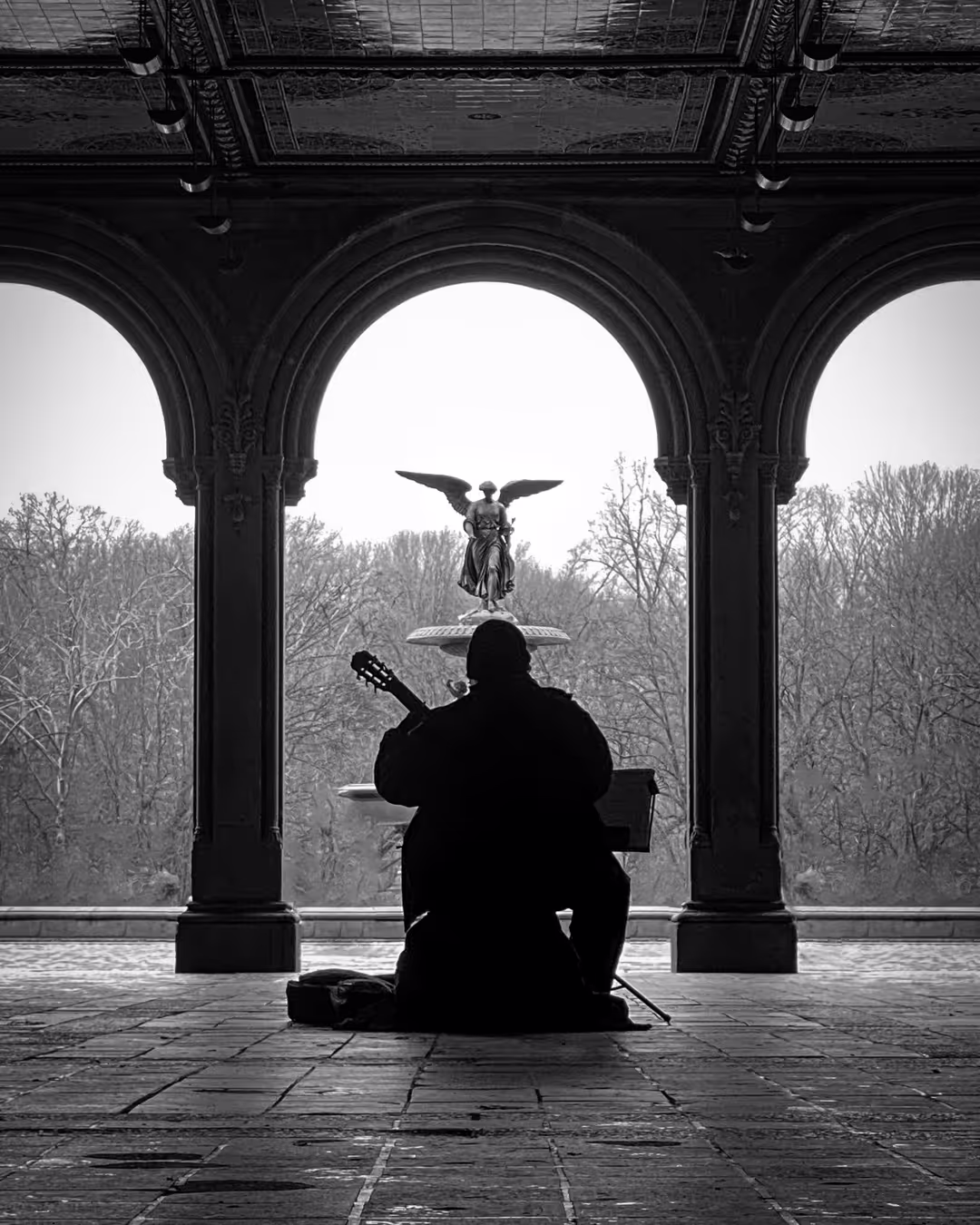 A black and white picture of a man playing violin